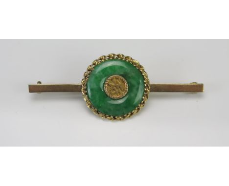 A 9ct Gold and Jadeite Roundel Brooch, 54.3mm long, stamped 9C, 5.08g 