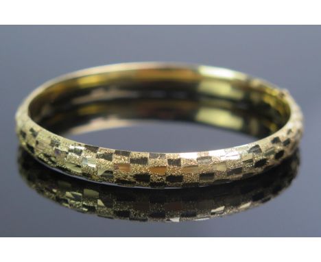 A Precious Yellow Metal Hinged Bangle, KEE tests as 14K, 11.25g.  UNLESS OTHERWISE STATED, THE KEE TEST IS A SURFACE TEST ONL