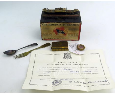 A WWI 1914-1918 Trench Art Brass Book Form Lighter, relic of Pope St. Pius X, a silver teaspoon, Mission to Seamen collection
