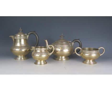 A George VI Irish silver four-piece tea service, maker Weir &amp; Sons, Dublin, 1949, of squat circular form with Celtic knot