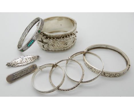 A Victorian silver buckle shaped bangle, a silver baby brooch etc Condition Report: Not available for this lot