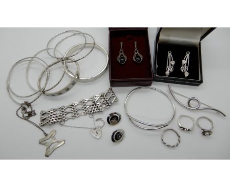 Silver gate bracelet with heart shaped clasp, silver bangles and other items Condition Report: Not available for this lot