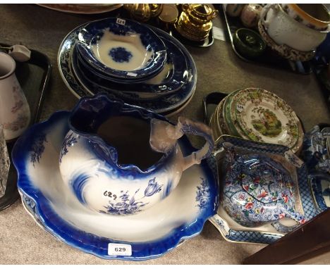 Assorted blue and white pottery including platters, washbowl and ewer, Ringtons teapot, assorted other pottery, wally dugs et