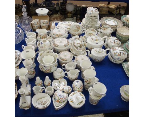An extensive collection of Aynslie Cottage Garden tablewares and ornaments comprising two graduated teapots, twelve cups, thi
