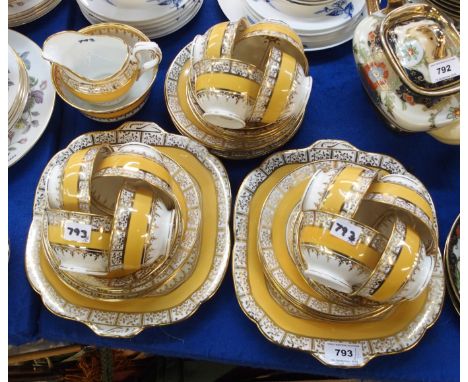 Collingwood teaset with yellow and gilt decoration comprising twelve cups, saucers and plates, two cake plates, milk jug and 
