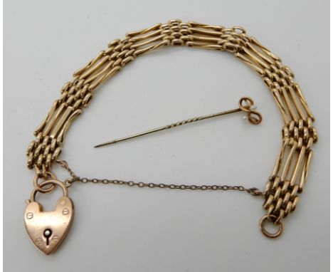 A 9ct gold gate bracelet, with heart shaped clasp, length 18cm, together with a 9ct knot pin set with pearls combined weight 