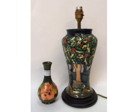 A Moorcroft table lamp in Holly Hatch pattern together with an Hibiscus patterned vase Condition Report: Available upon reque