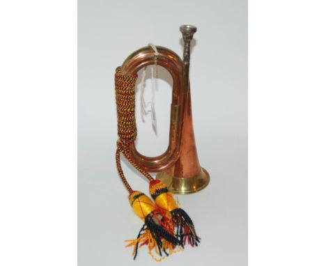 A brass and copper military bugle Condition Report: Available upon request