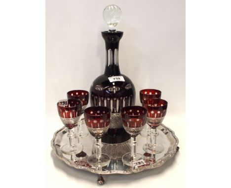 A ruby flashed and cut decanter and glasses set on EP tray Condition Report: Available upon request