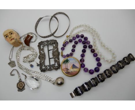 A glass bubbles necklace, amethyst beads, gilded enamel compact with pyramids and other items Condition Report: Not available