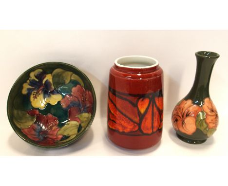 A Moorcroft hibiscus bowl, similar vase and a Poole Pottery vase Condition Report: Available upon request