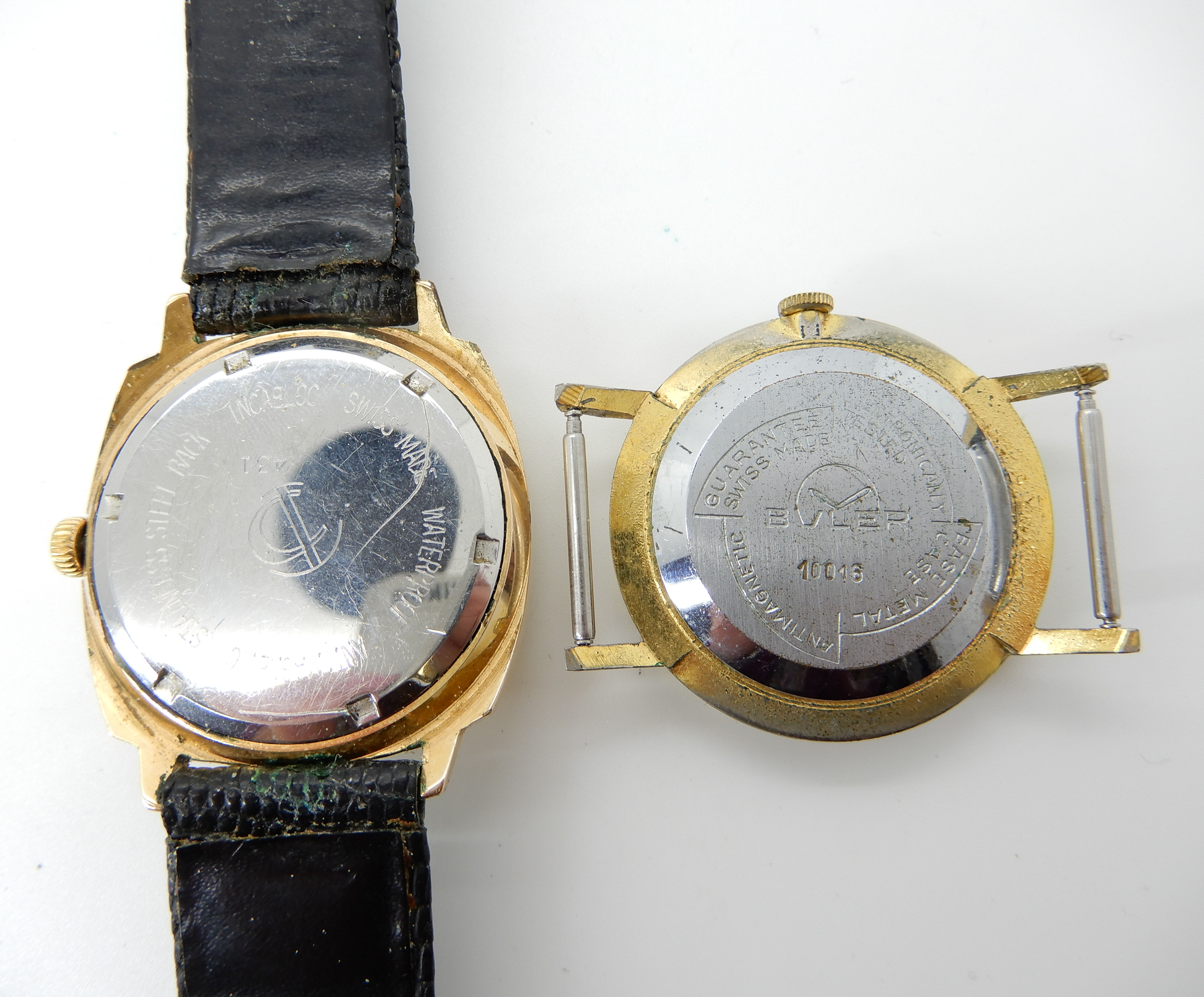 A gold plated vintage Buler watch head, together with a gold plated ...