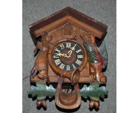 A box of miscellaneous including cuckoo clock, mantle clock, resin figures etc Condition Report: Available upon request