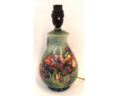 A Moorcroft freesia pattern table lamp, 26cm high Condition Report: crazed. 