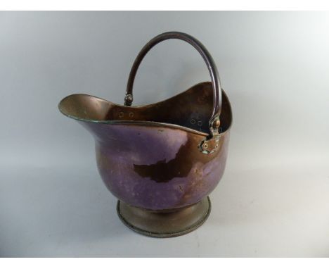 A Copper Helmet Shaped Coal Scuttle 