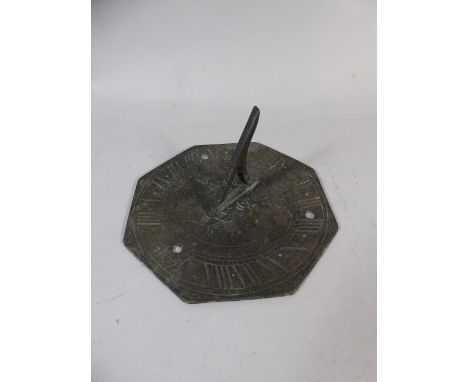 An Octagonal Metal Sundial Top, 16cm Diameter