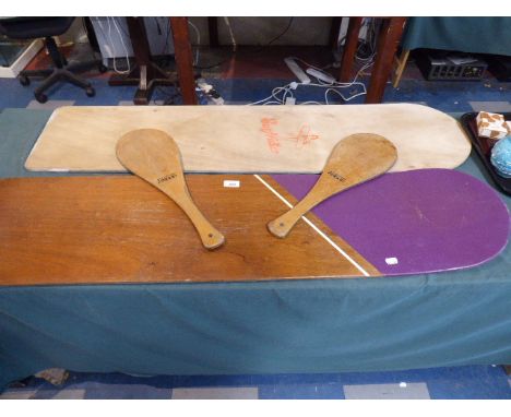 A Pair of Vintage Jokari Wooden Bats and Two Vintage Surf Rider Boards 