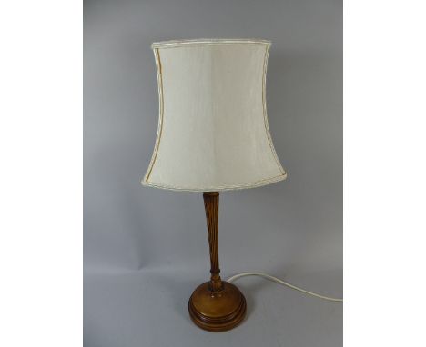 An Elegant Turned and Reeded Stemmed Wooden Table Lamp with Shade 