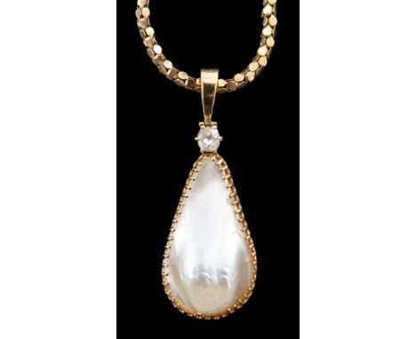 A 15ct gold mounted pear shaped baroque pearl and diamond set pendant, on an associated Italian 9k gold chain, pendant stampe