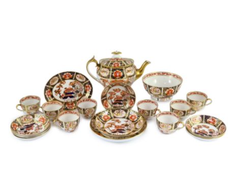 A Spode part tea service painted in Imari style with pattern 1956, c.1820, comprising a teapot cover and stand, two saucer sh