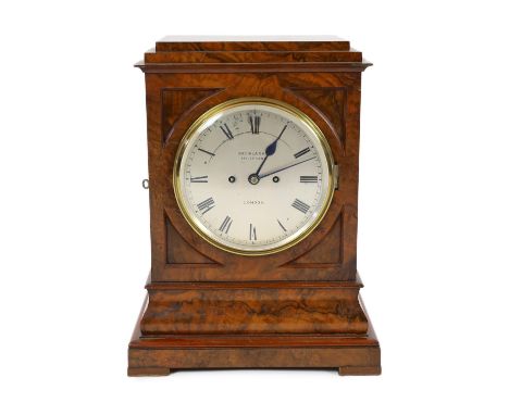 George Blackie, 392 Strand, London. A Victorian figured walnut mantel clock, in plain architectural case with silvered Roman 