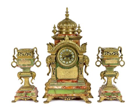 A late 19th century French ormolu mounted marble and green onyx clock garniture, of Indian inspiration, the main clock of arc