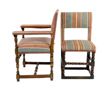 A matched set of twelve 17th century and later dining chairs, the rectangular backs and seats covered in pink and blue fabric