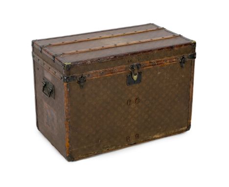 A Louis Vuitton brass mounted leather bound trunk, c.1910, numbered 137426, with LV covering and tooled leather mounts, the i