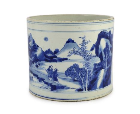 A Chinese blue and white ‘landscape’ brushpot, bitong, Kangxi period, painted to rectangular reserves with scholars in a moun