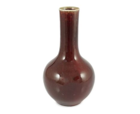 A Chinese sang-de-boeuf glazed bottle vase, 18th/19th century, with mushroom glaze at the rim graduating to mottled copper re