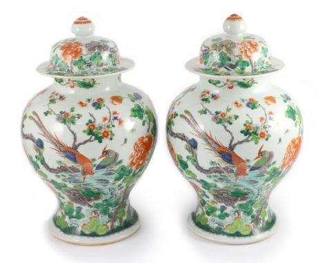 A pair of large Chinese famille verte jars and covers, late 19th century, each painted with pheasants amid rockwork and flowe