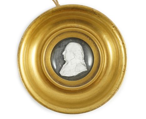 A Louis XVIII glass sulphide portrait plaque, in a gilded porcelain frame, c.1820, the cristallo-ceramie portrait of Louis XV