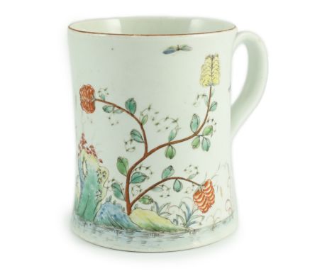 A rare Worcester polychrome 'flower and rockwork' small mug, c.1753-54, painted with rockwork, scrolling foliage, flowers and