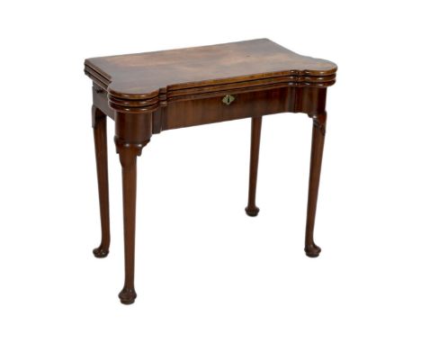 A George II mahogany games table, with eared triple folding top opening to reveal a baize surface with pockets, a backgammon 