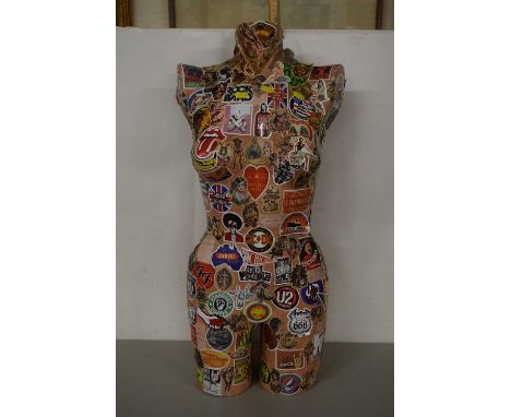 A decoupage decorated mannequin