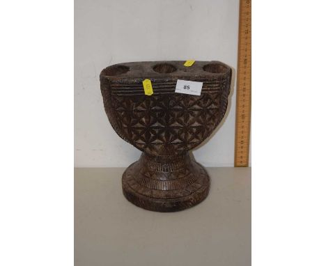 Tribal style carved three branch candlestick