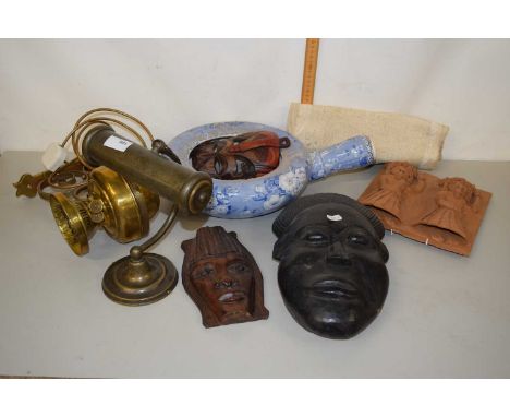 Mixed Lot: Carved African masks, blue and white bed pan, wall mounted oil lamp converted for electricity etc