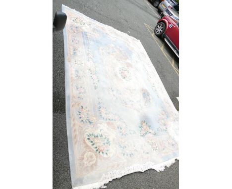 Very Large Chinese Tasseled Rug: some areas of fading noted. 334cm x 480cm, please be advised item is very heavy and will req
