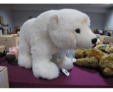 A Steiff Polar Bear, modern Teddy Bear with original ear stud and tag, number 527 from a limited edition of 1000, wearing a b