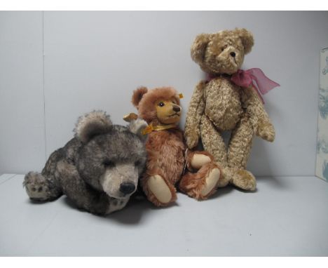 Three Modern Jointed Teddy Bears, between 16" and 20" high, includes two by Steiff, both tagged, one of which is a musical wi