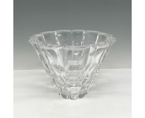 Clear crystal designed with undulating paneled waves. Orrefors mark. Issued: 20th centuryDimensions: 5.25"H x 7" dia.Manufact