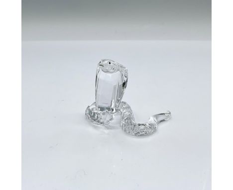 Part of the African Wildlife collection. A clear facetted crystal snake with a rhodium forked tongue. Swarovski swan marking.