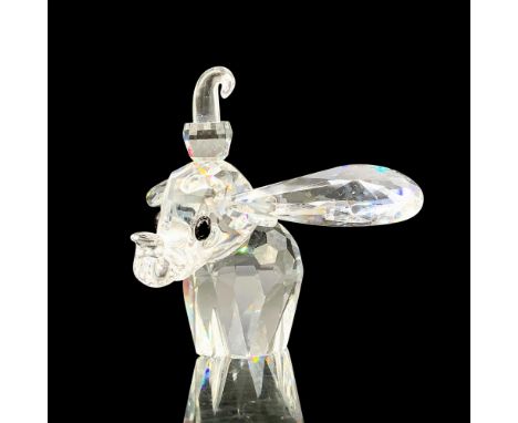 A clear crystal figure of Dumbo with his ears and trunk raised a bit. Black crystals are used for the eyes. Swarovski backsta