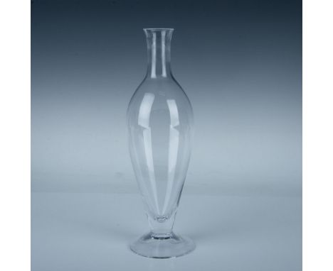 A clear wine or liquor vessel in an ovoid form with a round bottom and discus shaped stopper. Orrefors marked. Dimensions: 4"