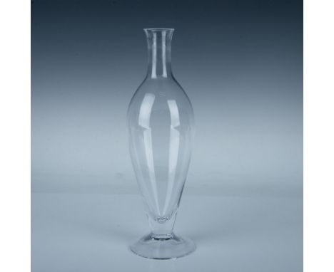 A clear wine or liquor vessel in an ovoid form with a round bottom and discus shaped stopper. Orrefors marked. Dimensions: 4"