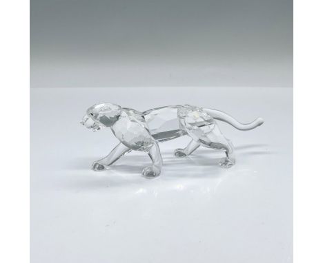 Part of the African Wildlife theme group. A clear facetted crystal feline stalking. Brown crystal eyes. Swarovski swan etched