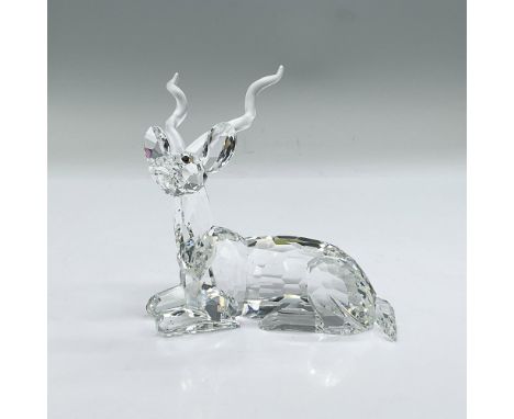 Striking cut crystal figure of a kudu, a type of antelope, lying down resting; frosted crystal horns. Part of the African Sun