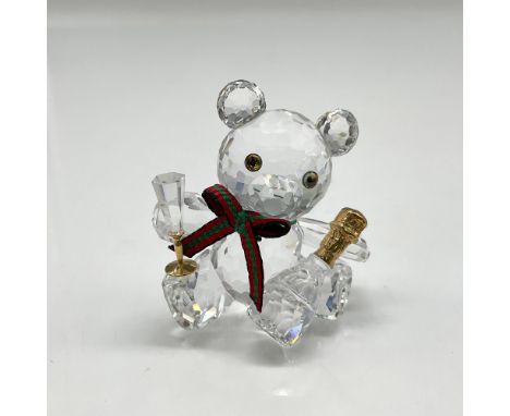 Cute crystal faceted figural is part of the When We Were Young theme group. Decked out with his holiday red and green bow hol