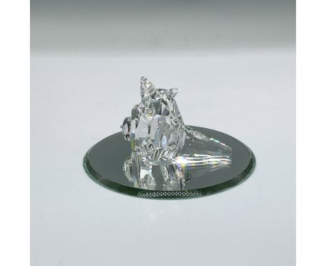 Clear faceted figure of a seashell with spiky protrusions. Swarovski mark. Part of the South Sea collection. This item has it