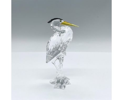 Part of the Feathered Friends them group. A clear body long-legged bird with a black crystal feather crown and a long amber b